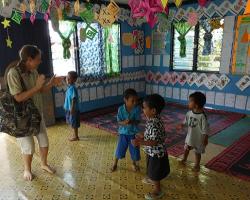 Alison dancing with kids in pre-school